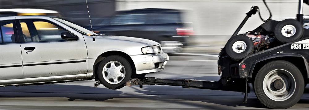 Motor Body tow truck on the road